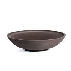 a brown bowl sitting on top of a white table