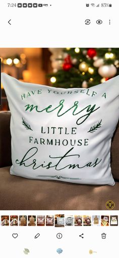 a pillow that has been placed on a couch in front of a christmas tree with the words merry little farmhouse