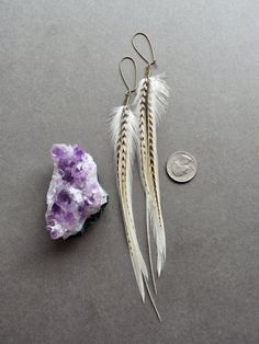 White Feather Earrings: These simple yet striking boho feather earrings are sure to become your new go-to for nights on the town! Perfect for expressing your bold sense of style wherever you go. ✧ Luxurious feathers in white, cream, and black ✧ 8 inches from hook to tip ✧ Ultra lightweight at only 0.5 grams each (less than a US dime) ✧ Aged brass kidney hooks for a secure fit ✧ Hypoallergenic steel hooks available on request ✧ Gift-ready in attractive, earth friendly box ✧ Handmade just for you, Bohemian Feather Earrings For Festivals, Bohemian Dangle Feather Earrings, Adjustable Gold Feather Earrings, Elegant Adjustable Feather Earrings, Bohemian Dangle Earrings With Feathers, Elegant Feather Earrings For Festival, Elegant Feather Jewelry For Festivals, Elegant Feather Earrings, Boho Bridal Earrings