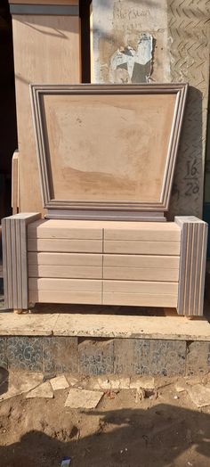 a large wooden box sitting on top of a stone slab