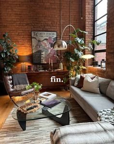 a living room filled with furniture and lots of plants on top of the coffee table