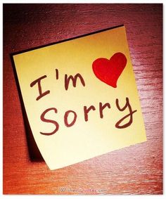 a sticky note with the words i'm sorry written on it and a red heart