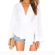 Questions? Leave A Comment Below! Chic Wrap Blouse For Party, Elegant Wrap Top For Spring, Elegant Wrap Blouse For Summer, Elegant Summer Wrap Blouse, Chic Evening Wrap Top, Spring Evening Wrap Blouse, White Wrap Blouse For Work, White Wrap Blouse For Workwear, White Long Sleeve Top For Date Night