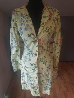 "This is a beautiful Y2K lime green longer blazer coat.  Could even be worn as a coat dress.  The colors are bright and it is embroidered with style and beautiful, bright flowers and strawberries.  This is a perfect coat to brighten up an outfit!  Great for summer, spring, and even fall.   The size is extra small.  There is no fading, pulls or holes.  Excellent condition.   It is almost all cotton with just a small amount of spandex for a big of stretch.  This could be worn over jeans, white or blue trousers, or just as its own dress.   It is really darling.  The RN is 87294.   Women's extra small.  A little tight on my mannequin whose waist is 26\" and hips are 36\" Measured flat across the front: Shoulder to shoulder: 15.5\" Armpit to armpit: 17\" Waist: 13\" Hips: 17\" Length: 36\" Arm Fitted Long Green Outerwear, Fitted Yellow Summer Outerwear, Fitted Yellow Outerwear For Summer, Green Floral Print Outerwear For Summer, Green Floral Print Summer Outerwear, Fitted Floral Print Outerwear For Spring, Fitted Green Outerwear For Spring, Fitted Floral Print Spring Outerwear, Green Cotton Outerwear For Daywear