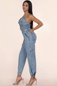 This two-piece Stone Denim set features an all-over acid-wash and exposed seams on skinny jeans and a cropped top. The cropped bustier-style denim top buttons at the front with 4 gold-toned buttons and adjustable straps cross in the back. Matching high-rise jeans fit slim at the cuff where a single snap-button on each cuff can be opened for a looser fit. These button-fly jeans have five gold-toned buttons, two slant pockets in front, and 2 back pockets. 100% COTTON Fitted Denim Cargo Jeans For Summer, Chic High Waist Fitted Cargo Jeans, Fitted High Rise Cargo Jeans For Summer, Trendy High-waist Denim Blue Crop Top, Trendy Fitted Denim Blue Cargo Jeans, Trendy Denim Crop Top, Fitted High Waist Light Wash Cargo Jeans, High Waist Fitted Light Wash Cargo Jeans, Trendy Cropped Denim Jeans