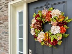 a wreath is hanging on the front door