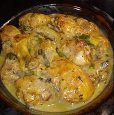 chicken and vegetable dish in a pan on top of the stove, ready to be eaten