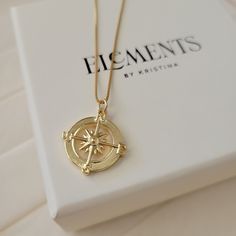 "Round gold compass pendant necklace. Wear it on it's own or layer it. Crafted on sturdy non tarnish 14K gold filled box chain. Pendant details:  * Finish: non tarnish 14K gold filled  * Size: 23mm x 19mm Comes in our gift ready packaging: vegan leather pouch for safe jewelry storing and branded box  GOLD FILLED Tarnish Resistant. Hypoallergenic. Long Lasting. Gold filled is affordable alternative to solid gold. Hypoallergenic - sensitive skin friendly. With proper care it will last for years. W