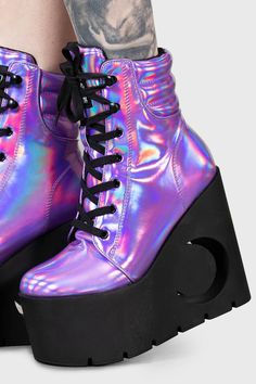 DIANA.- Statement holographic boot.- Platform wedge heel with crescent cut-out.- Lace up closure.- Platform height 7cm/2.7"- Heel height 13.5cm/5.3"with KILLSTAR branding, 100% PU. Holographic Boots, High Heel Platform Boots, Holographic Fashion, Rave Shoes, Demonia Boots, Punk Style Outfits, Purple Holographic, Rainbow Laces, Goth Shoes