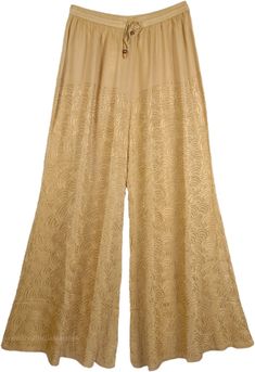 Easy Going Casual Everyday Lounge Pants in Twine Color - Chic meets sweet in our classic embroidered rayon pant with an elasticated drawstring waistband. These luxurious soft and stretchy mid weight pants made with soft flowy rayon have a hippie boho vibe and are comfortable for casual summer beach wear or running errands around town. The pants have delicate embroidery with similar thread all around the pant. This classic pant can be effortlessly dressed up or down for a summer-ready look. A rel Stretch Floral Embroidered Bottoms, Embroidered Wide Leg Beige Pants, Embroidered Beige Wide Leg Pants, Embroidered Relaxed Fit Bottoms For Loungewear, Embroidered Wide-leg Beige Pants, Embroidered Full-length Bottoms For Spring, Embroidered Bottoms For Spring Loungewear, Embroidered Full Length Bottoms For Spring, Spring Embroidered Bottoms For Loungewear