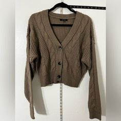 Boutique Quality/Style Chunky Over-Sized Button-Up Cardigan Sweater That Is Perfectly Matched With Boot-Cut, Flair, Skinny Or Distressed Style Pants Trendy Brown Button-up Cardigan, Trendy Brown Sweater With Button Closure, Oversized Cream Cardigan, Sleeveless Sweater Cardigan, Black Poncho, Long Open Cardigan, Burgundy Cardigan, Long Black Cardigan, Long Knit Sweater