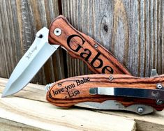 a personalized knife with the name crabe on it and its blade sticking out