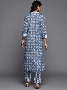 This is a beautiful 2-piece set. The set comes with straight cut kurta consist of ethnic motif print detailing has mandarin collar, 3/4th sleeves, calf length & side slits teamed with printed trouser pants has elasticated waistband and slip on closure. Piece-2 Piece Set Color-Blue Kurta Fabric-Cotton Bottom Fabric-Cotton Work - Ethnic Motif Print Detailing Neck-Mandarin Collar Sleeves- 3/4th Sleeves Kurta Length - Calf Length Bottom-Elasticated Waistband & Slip-on Closure Style-Kurta Trouser Set Navratri Sets With Printed Border And Straight Kurta, Spring Block Print Straight Kurta Set, Spring Straight Kurta With Printed Border, Spring Straight Kurta With Ikat Print, Festive Cotton Kurta With 3/4 Sleeve, Ikat Print Straight Kurta Set For Diwali, Fitted Cotton Kurta With 3/4 Sleeves, Spring Ikat Print Straight Kurta, Diwali Printed Straight Kurta