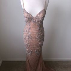 a mannequin wearing a dress with beading on it