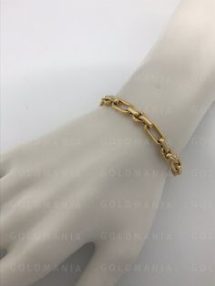 "14K Yellow Gold Oval Cable Link Chain Bracelet, 7.5\" Inch, 6.3mm Thick, Oval Link Bracelet, Woman Gold Bracelet, Real 14K Gold Bracelet 7.5\" - 4.9 Gram Metal: 14K Yellow Gold Hollow Gold Bracelet NOT PLATED/ NOT FILLED/ NOT SILVER FREE SHIPPING IN THE USA on all orders 30 Day Return Hassle Free Weight and measurements are approximate and may not always be exactly as stated . At GoldMania we are first of all committed to environmental responsibility. We guarantee that the silver, platinum, pal Formal Oval Link Chain Bracelet With Polished Finish, Formal Chain Bracelet With Oval Link And Polished Finish, Formal Polished Chain Bracelet With Oval Links, Classic Hallmarked Gold Oval Link Bracelet, Formal Gold Jubilee Bracelet With Oval Link, Elegant Yellow Gold Oval Chain Bracelet, Elegant Oval Chain Bracelet For Formal Occasions, Tarnish Resistant Gold Oval Bracelet, Classic Gold Oval Link Bracelet With 17 Jewels