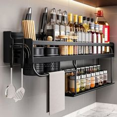 a shelf with spices and utensils hanging on it's side in a kitchen