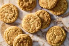 several cookies are on a marble surface