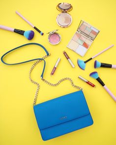 Blue and yellow flatlay featuring a blue dkny  handbag Dkny Handbags, Blue And Yellow, Leather Flats, Layout