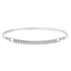 14K white gold diamond bar bangle bracelet from the Reis-Nichols Collection. The bracelet features 17 round brilliant cut diamonds weighing .60 ctw. Luxury Diamond White Brilliant Cut Bangle, Channel Set Diamond Bangle Bracelet, White Gold Channel Set Diamond Bangle Bracelet, White Gold Channel Set Diamond Bangle, Channel Set White Gold Diamond Bangle Bracelet, Channel Set Diamond Bangle In White Gold, White Gold Diamond Bangle With Channel Set, White Gold Diamond Bracelet, Gold Diamond Bracelet