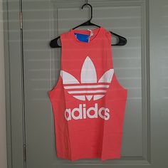 Adidas Originals Tee Condition: New Color: Neon Pink Size: M/ L No Holds/ Trades Adidas Sporty Cotton Tank Top, Adidas Cotton Tank Top For Spring, Adidas Sporty Summer Tank Top, Adidas Athleisure T-shirt For Summer, Adidas Casual Summer Tank Top, Adidas Summer Athleisure T-shirt, Adidas Casual Sleeveless Top, Casual Adidas Summer Tank Top, Casual Adidas Sleeveless Top