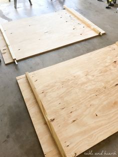 two pieces of plywood sitting on top of a floor