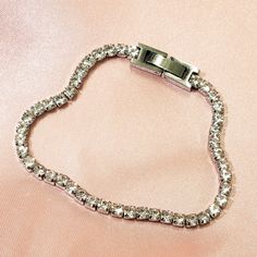 Our Diamond Tennis Bracelet has a unique look that makes it perfect for wearing alone or layering. This bracelet is made using a real 18k gold dipped stainless steel chain and cubic zirconia crystals, which makes it stand out from all the rest. A beautiful piece of jewelry made in California by women who know what they love! ✔Hypoallergenic ✔Quality Guaranteed ✔Water Resistant ✔Handmade COLOR: gold or silver LENGTH: 6 1/2 inches + optional 1-inch diamond tennis link MATERIAL: Stainless steel dip Tennis Bracelet Gold, Tennis Chain, Diamond Tennis Bracelet, Tennis Bracelet Diamond, Gold Dipped, Tennis Bracelet, Silver Diamonds, Stainless Steel Chain, Infinity Bracelet