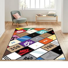 a colorful rug with nike logos on it in a living room next to a chair