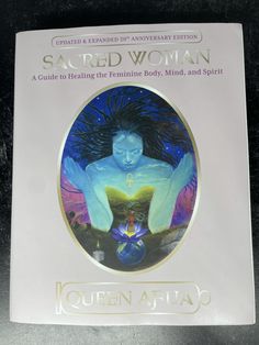 a book with an image of a woman sitting on top of her body and the title sacred woman