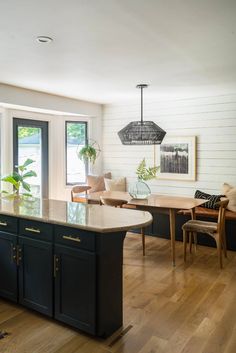 the kitchen is clean and ready to be used as a dining room or living room