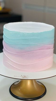 there is a cake with pastel colors on it