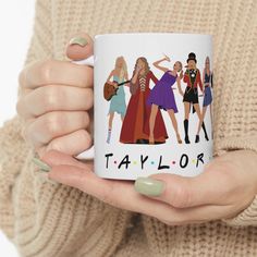 a woman holding a coffee mug with the name taylor on it