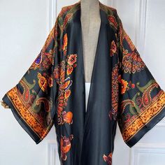 One Size fits S-3X/4X Kimono length: 58inch Material: Poly Silk (a lightweight, smooth, and shiny fabric that drapes and flows very well. An affordable alternative to silk) One Size Fits Most Size Chart Elegant Multicolor Silk Kimono, Fitted Multicolor Silk Kimono, Luxury Black Silk Kimono, Silk Long Sleeve Floral Print Kimono, Luxury Silk Printed Kimono, Shiny Fabric, Long Kimono, Silk Kimono, Silk Crepe