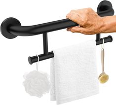 a hand holding a towel rack with two black handles