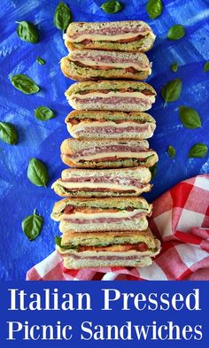 italian pressed picnic sandwiches stacked on top of each other