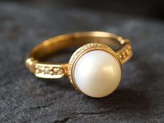 Gold Pearl Ring set with a Natural Pearl, AAA grade (stands for roundness, luster & color), at 10mm diameter, sourced from Japan. Made of Gold Vermeil ☞ thickest 18k Gold Plating on top of Solid 925 Sterling Silver ☞ made to last. Matching Earrings - please ask me June Birthstone - Genuine & Natural Stones ❀ ☞ Choose your size ☞ I resize (before shipping) for FREE to Any size* ❀ Each Natural Gem is unique & will have Slight variations from the product pictures "no two Natural Stones are alike" D Gold Dome Ring With Bezel Setting For Wedding, Round Dome Ring With Bezel Setting For Wedding, Wedding Dome Ring With Bezel Setting, White Round Dome Ring For Anniversary, White Pearl Ring With Bezel Setting For Wedding, Round Pearl Ring With Halo Design For Anniversary, White Oval Dome Ring For Wedding, Pearl Ring With Halo Design For Anniversary, Round Halo Design Pearl Anniversary Ring