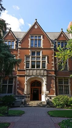 the front entrance to an old brick building