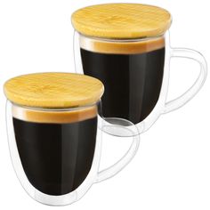 two coffee mugs with wooden lids are shown in front of each other on a white background