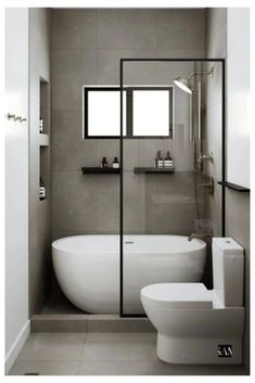 a bathroom with a tub, toilet and sink