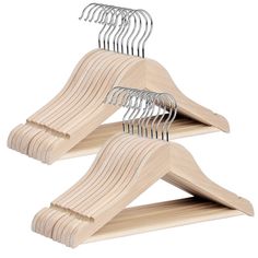 three wooden hangers with metal clips on them