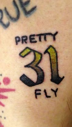 a close up of a person's arm with a tattoo that reads, pretty 31 fly