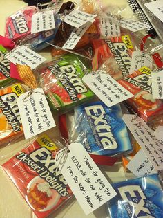 a pile of packaged snacks sitting on top of a table