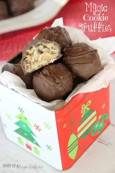 a box filled with chocolate covered cookies on top of a table