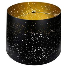 a black lamp shade with gold speckles on it