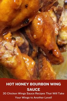 chicken wings with sauce on top and the words hot honey bourbon wing sauce above it