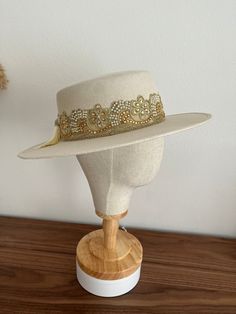 Introducing our beautifully handcrafted Boater Hat with a wide brim, a perfect addition to your fashionable accessories collection. This hat is expertly made with attention to detail, ensuring a high-quality finish. It features a flat brim that adds a touch of boho elegance, making it a versatile choice for any outfit.  Highlights:  - Measurements: Crown 10.5cm / Brim 8.5 cm  - Elastic band inside - Each hat includes a protective bag - Delivery from a small business in Germany - Made from vegan Gold Wide Brim Fedora For Festivals, Elegant Beige Fedora With Flat Crown, Gold Fedora With Short Brim For Festivals, Spring Adjustable Top Hat With Flat Crown, Spring Adjustable Flat Crown Top Hat, Elegant Cream Fedora With Flat Crown, Elegant Spring Top Hat With Flat Crown, Adjustable Cream Boater Hat With Flat Crown, Adjustable Beige Felt Hat With Flat Crown