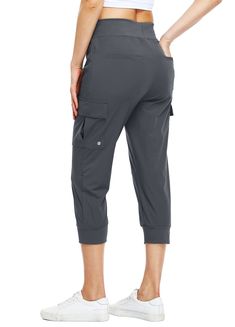 the back view of a woman wearing grey cargo pants