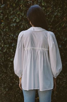 With a sweet Peter Pan collar, our newest blouse is an elevated take on the basic button down—and a layering must-have come cooler weather. Made in a breathable organic cotton, she has pretty puff sleeves and hits at the perfect length for wearing loose or tucked in. Pair her with your fav pants or our new Baye pant in Kara Thoms, Cooler Weather, Pan Collar, Peter Pan Collar, Peter Pan, Puff Sleeves, Puff Sleeve, Layering, Sewing Patterns