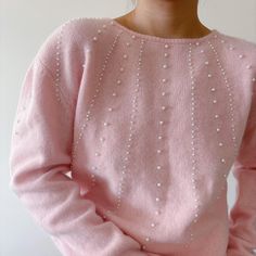 Vintage pullover sweater. Cutest pink color. Beaded with faux pearls. It seems to have wide shoulders, maybe that's where the shoulder pads were.  Excellent vintage condition Material: 70% lambs wool, 20% angora, 10% nylon.   label size M. Model is 5'5'', 128 lbs, usually US size 5 Flat measurements: bust: 20'' (40'' around) Across the shoulders: 19'' length: 24'' Follow us on Instagram (oldgemvintage) for more choices! Please ask me about international combined shipping.  Please check the flat measurements before purchase since all sales are FINAL. Except it is mistake on my part, in which case I will refund the purchase. I do my best to examine the garments but make mistakes sometimes, please let me know if that is the case. Thank you so much!  Please note that these are vintage clothing Pull Angora, Wide Shoulders, Pull Rose, Vintage Pullover, Angora Sweater, Minimalist Capsule Wardrobe, Vintage Pullovers, Angora Rabbit, Rose Blush