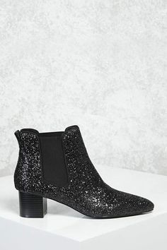 Forever 21 Glitter Chelsea Boots, Details A pair of Chelsea boots featuring an allover glitter design, a block heel, pointed toe, and elasticized sides. Content + Care - Padded insole, textured outsole - Upper & Insole: 100% polyurethane - Lining: 100% polyester - Outsole: 100% rubber - Made in China Size + Fit - Heel height: 2" - Shaft height: 4.75" Cute Work Outfits, Trendy Mom, Stylish Mom, Black Chelsea Boots, Jimmy Choo