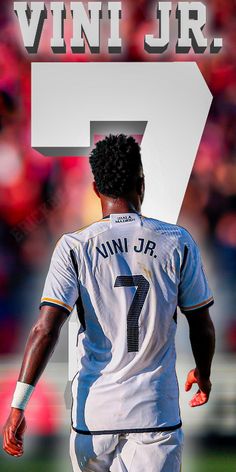 a soccer player is running with the number seven on his shirt and numbers behind him